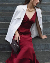 Tailored silk blazer with structured shoulders and notched lapel for refined layering